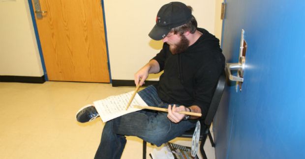 Southeast senior Kyle Simpson practices a snare drum cadence prior to auditioning for District Band.