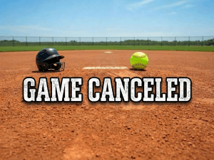 Wet softball on muddy field with text 'GAME CANCELED'