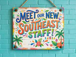 Sign reading 'Meet our new Southeast staff! Stay tuned coming soon' with tropical decorations